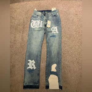 straight denim MNML jeans that have the word war written on it.